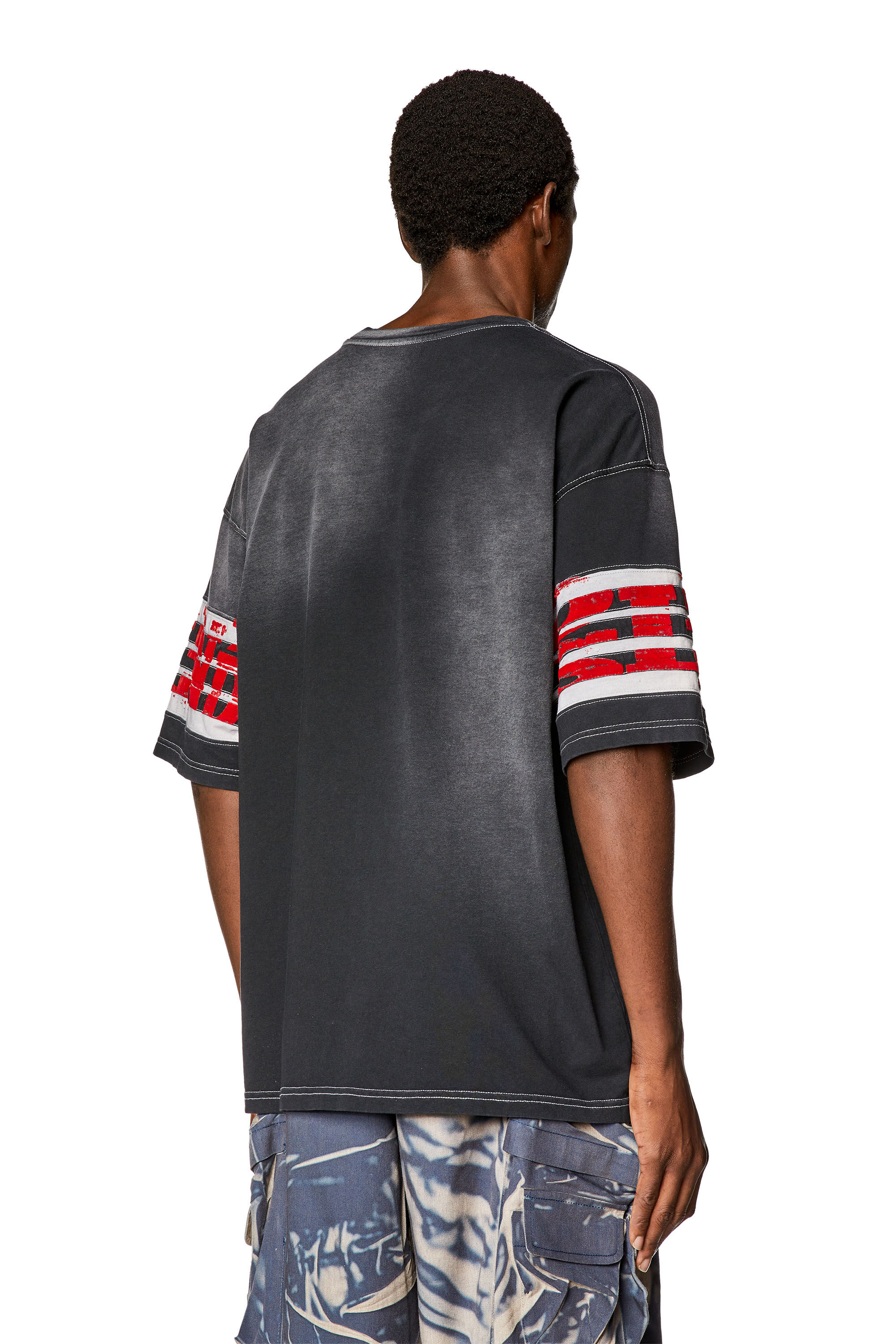 Diesel - T-BOST, Herren Ausgewaschenes T-Shirt mit aufgeflockten Prints in Schwarz - 4