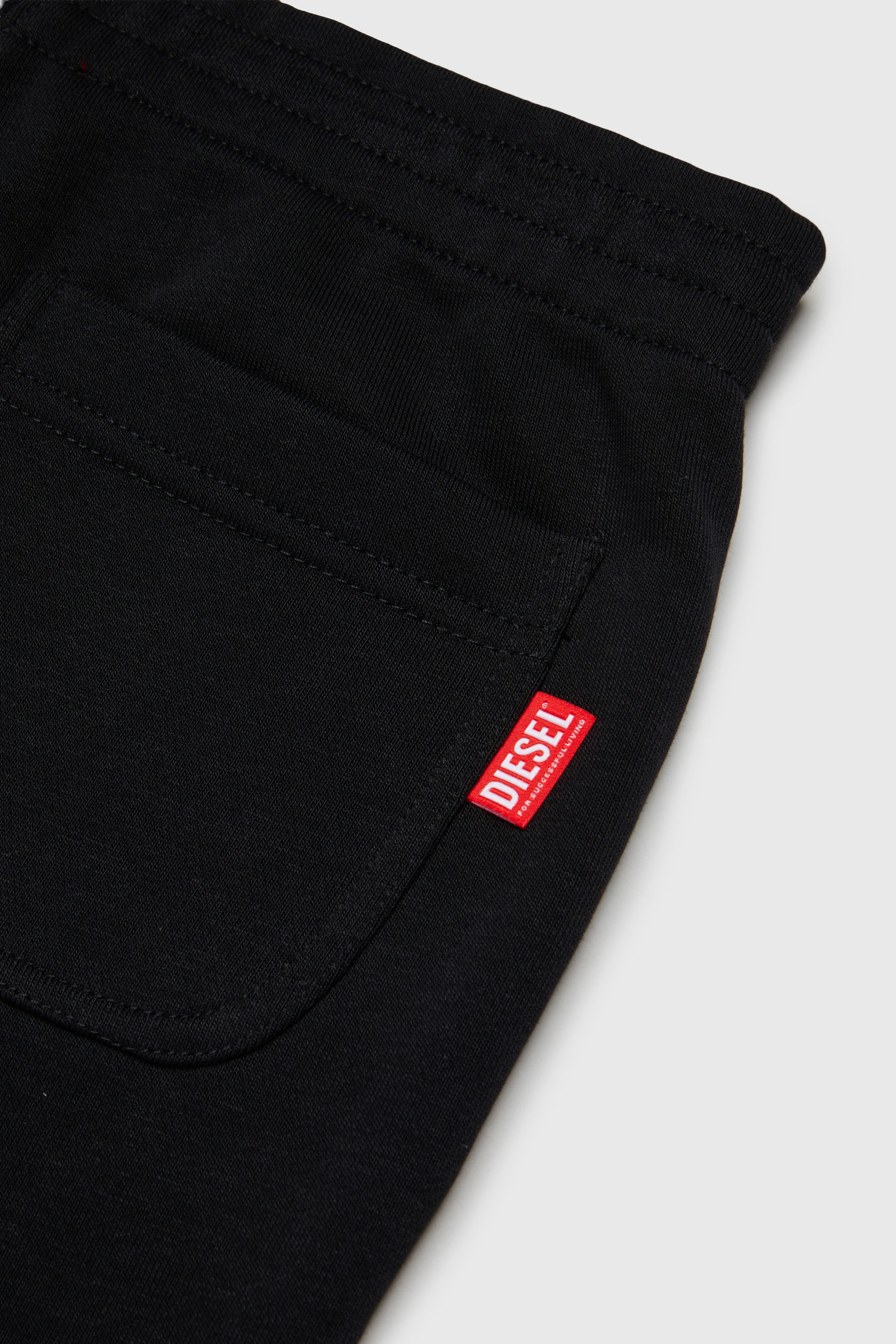 Diesel - PRES, Herren Sweatpants mit abgeschnittenem Logo-Print in Schwarz - 4
