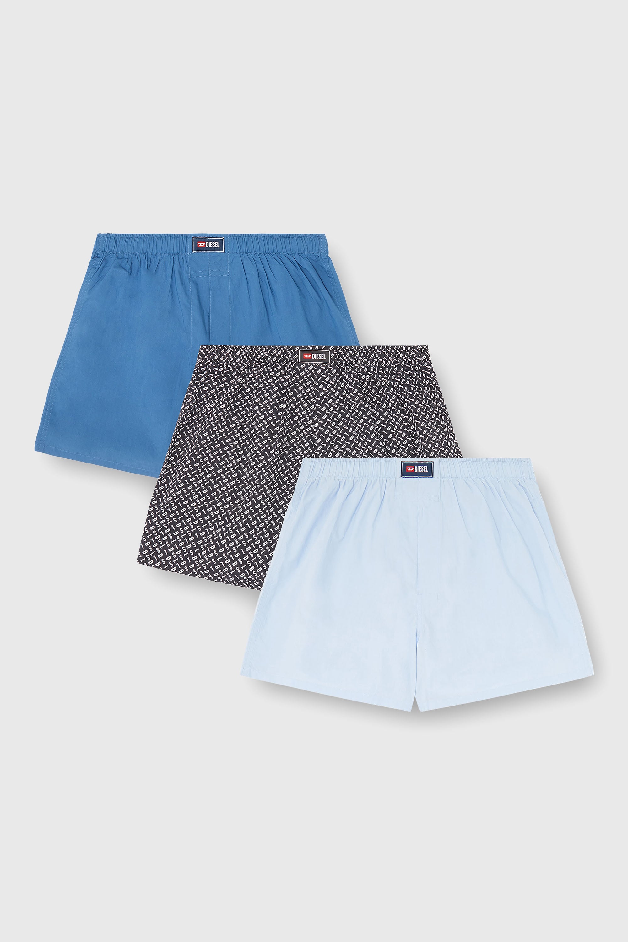 Diesel - RYAN-D-CORE-3PACK, Herren Boxershorts aus Baumwolle mit unifarbenem und all-over DSL-Print im Dreierpack in Blau - 1